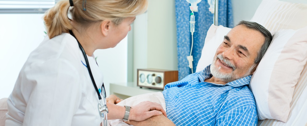 doctor or nurse talking to patient in hospital
